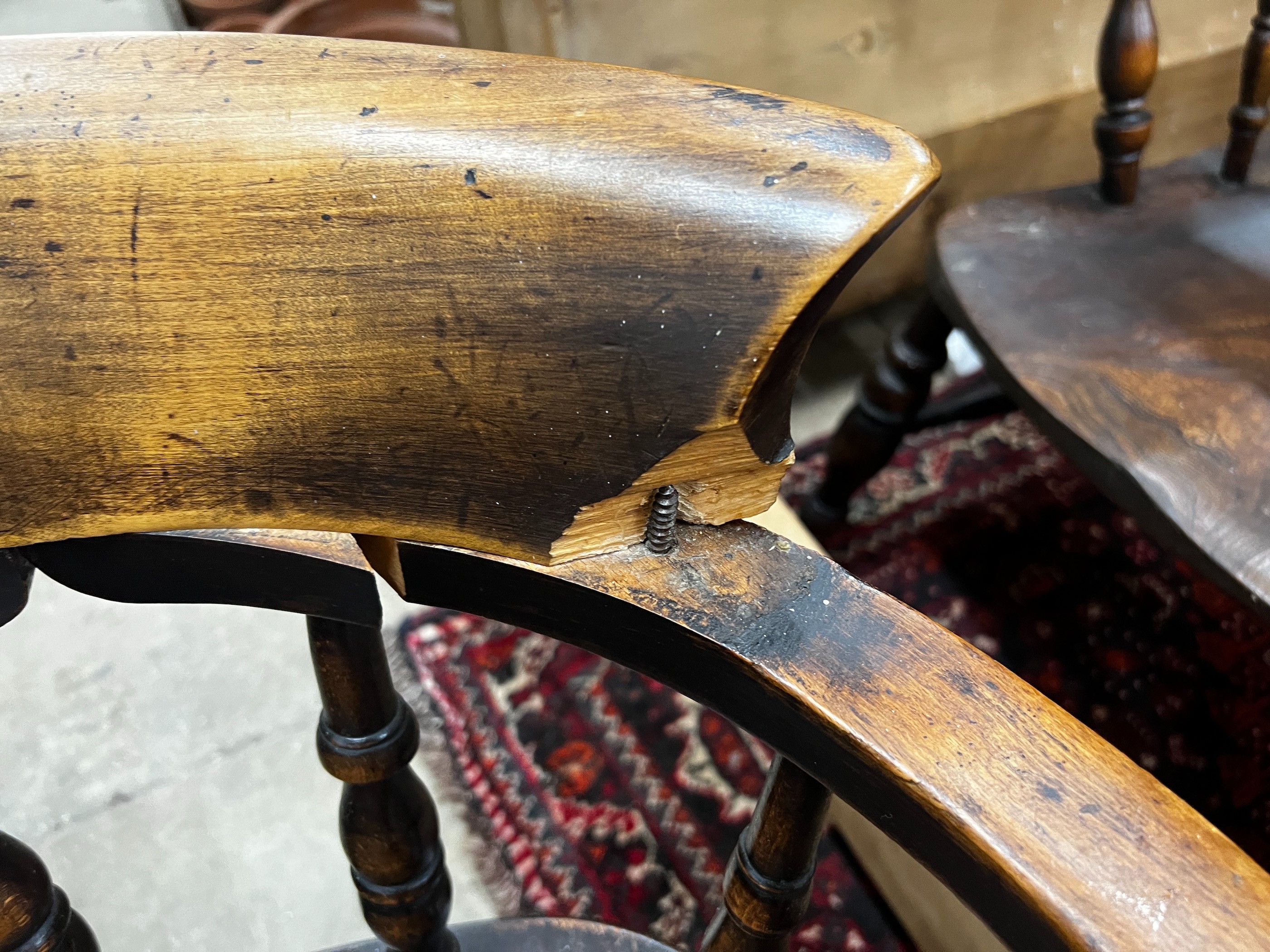 A harlequin set of five Victorian elm and beech smoker's bow chairs